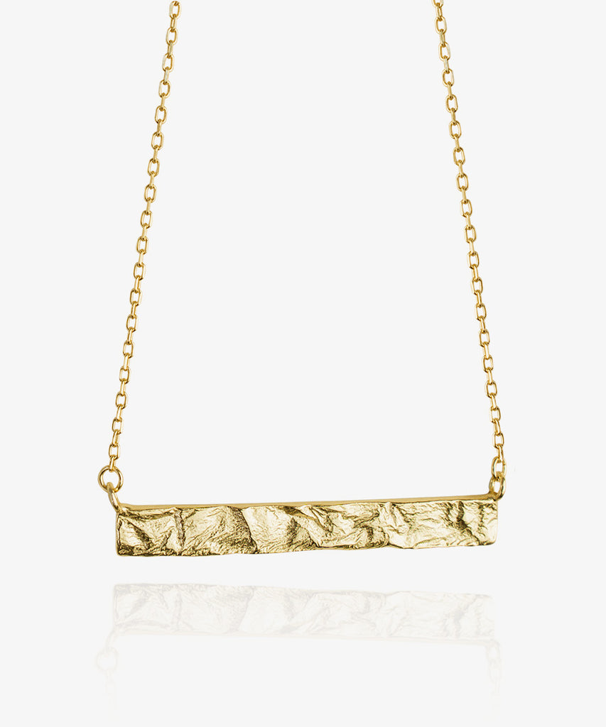 Oceania necklace. Stunning natural rectangular shaped gold necklace on white background