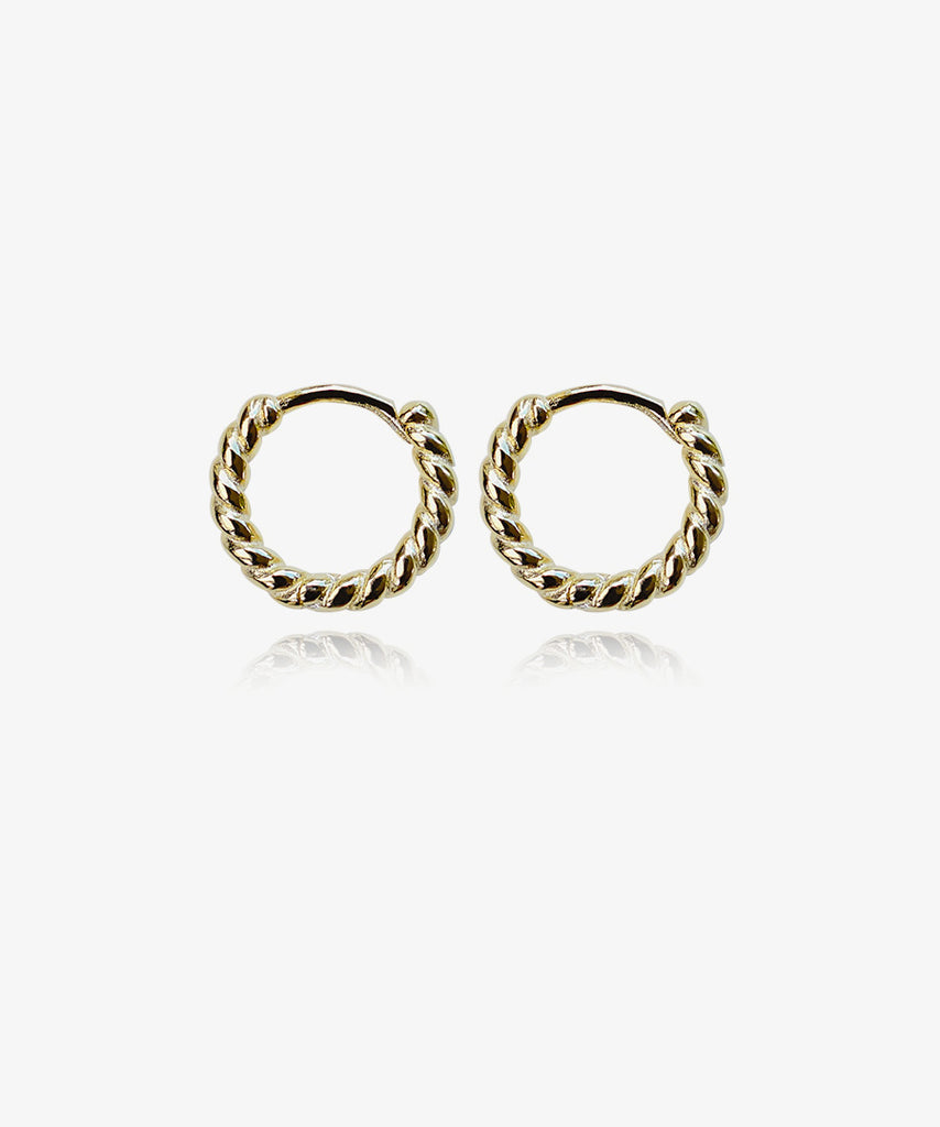 14k gold plated sterling silver Adara huggie earrings on white background