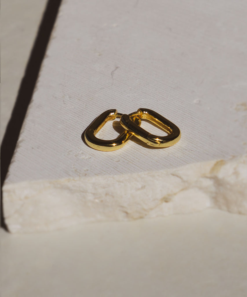 18k gold plated Avoca mini earrings on marble surface