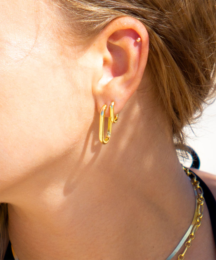 Model at Byron bay beach wearing Avoca Gold Vermeil earrings