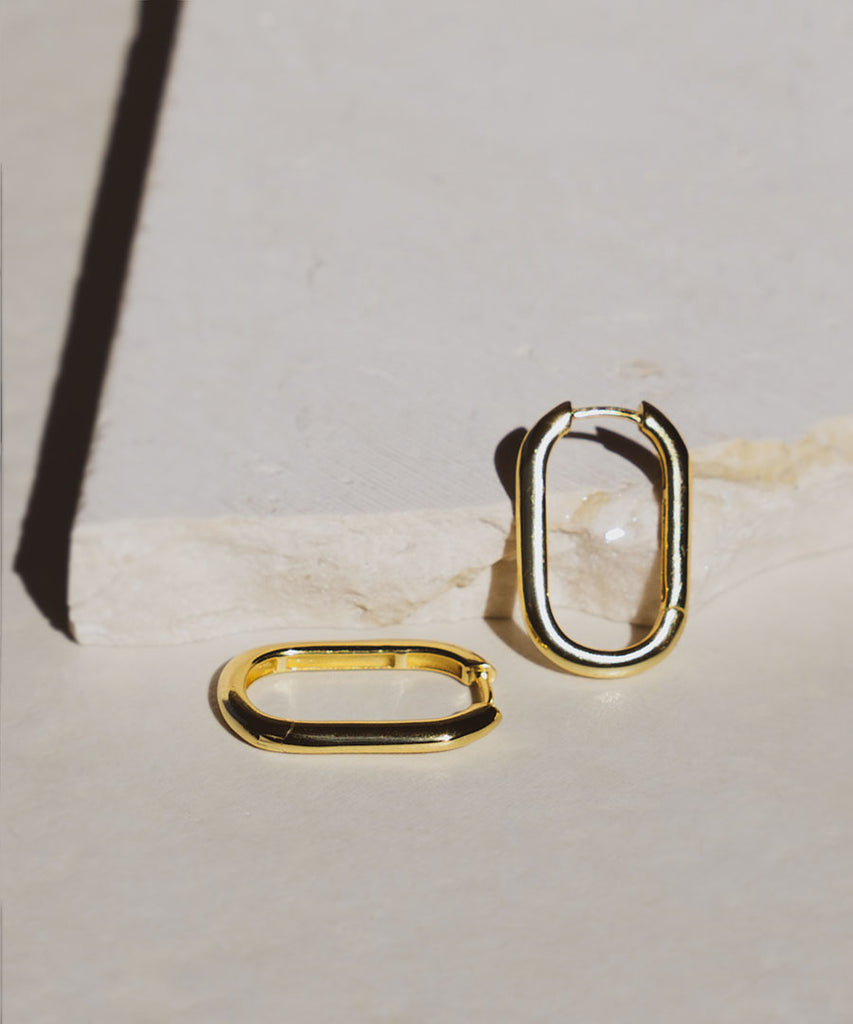 18k gold Avoca earrings on marble surface