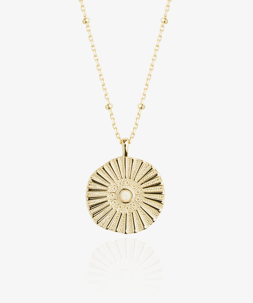 beautiful 18k gold Sunny coin necklace on white background