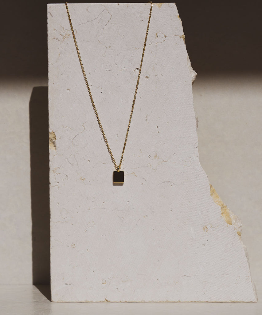 Minimal necklace on a marble surface