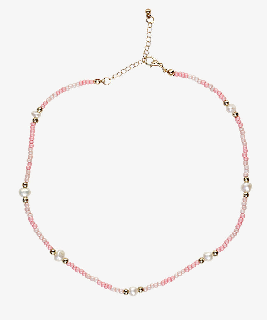 Rose pearl necklace on white background