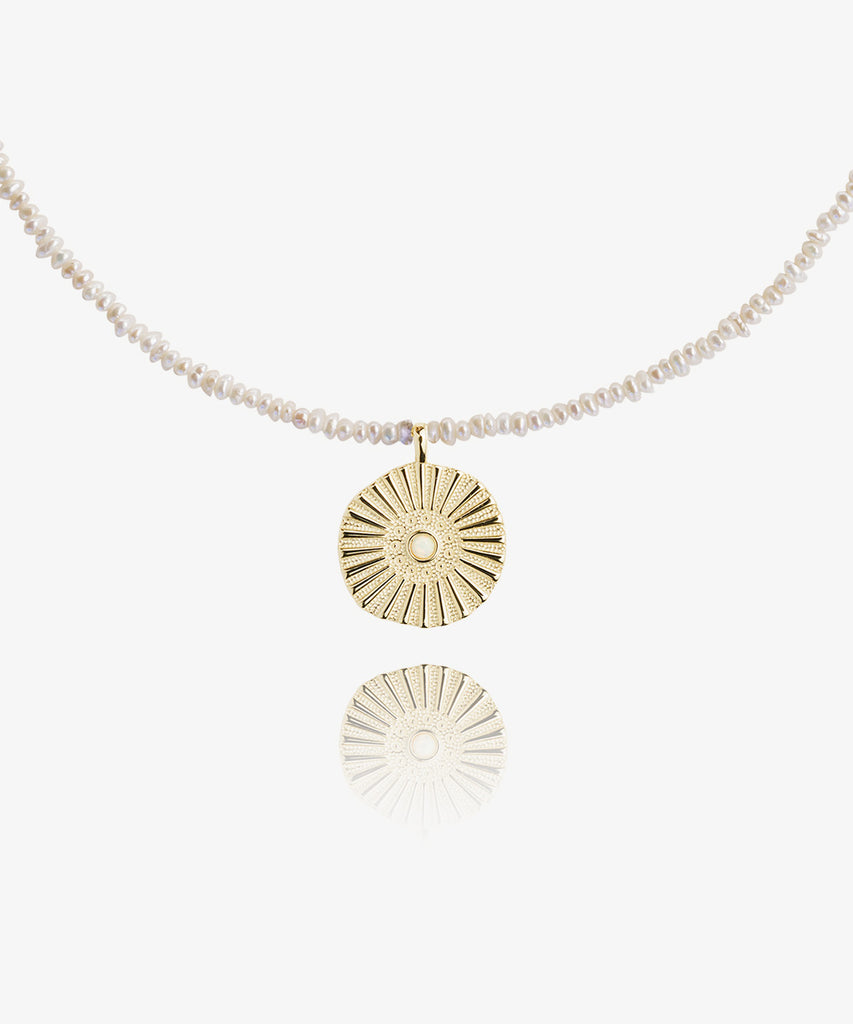Soleil necklace on white background