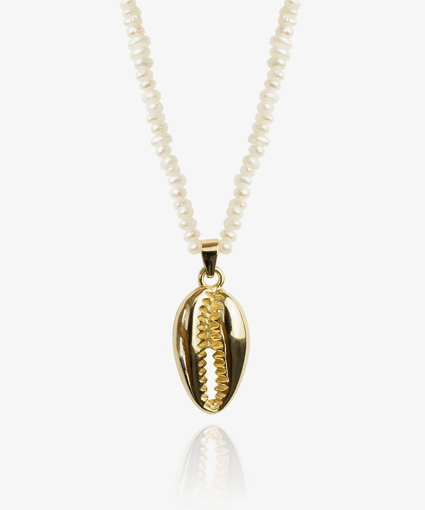 Beautiful Shell gold pendant with pearl chain on white background